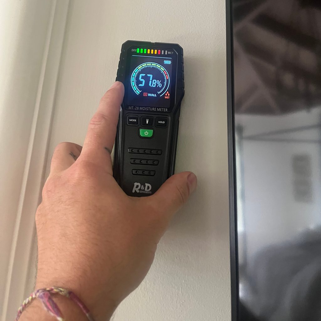 Contractor uses device to test home energy efficiency.