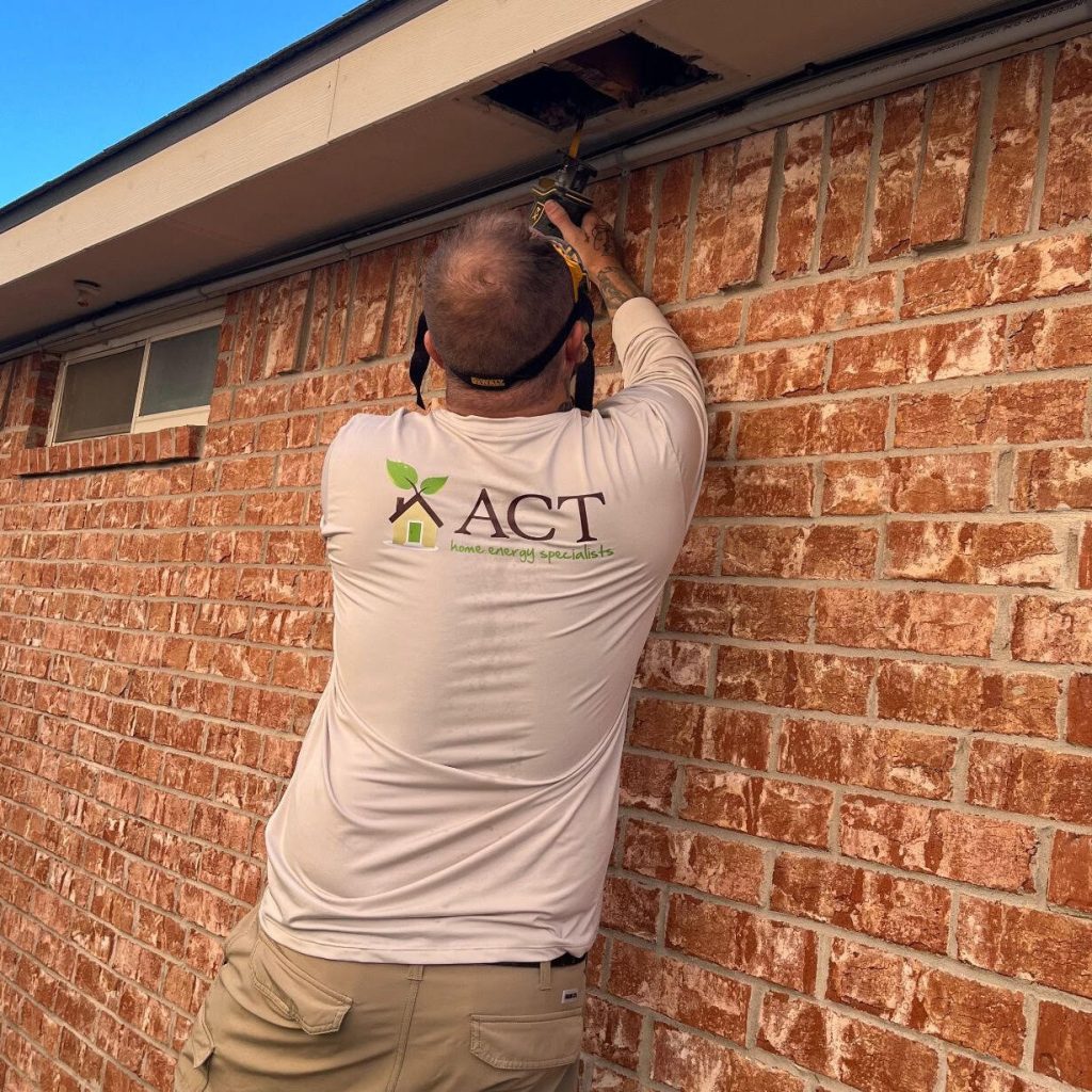Contractor cuts out soffit vents to ensure  proper airflow.